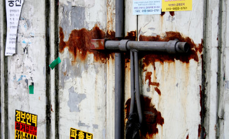 Old rusty door of a store in Seoul, Koreaの写真素材