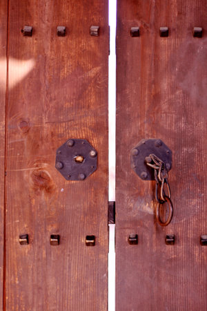Korean traditional old wooden door with metal lock and keyhole in Seoul, Korea, closeup photoの写真素材