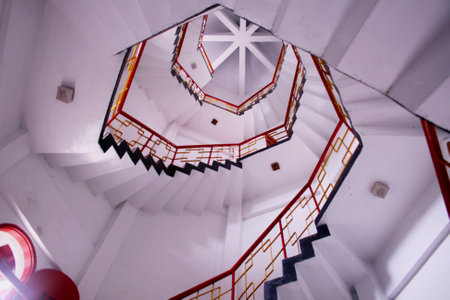Spiral staircase in a white building. View from the topの写真素材