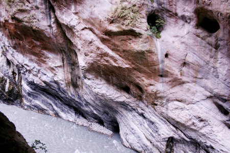 Mountain landscape with a river flowing through a canyon in Taiwan.の写真素材
