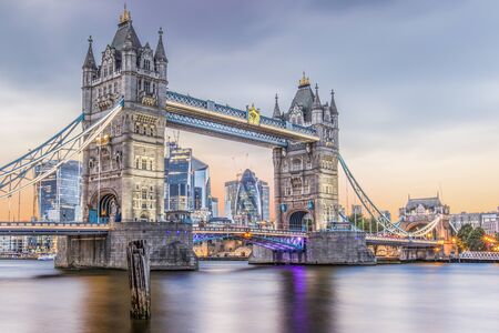 The sun setting behind Tower Bridge in London.の写真素材