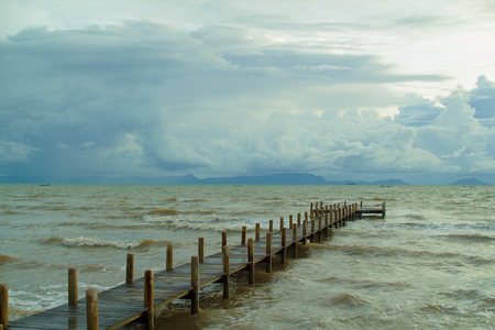 empty jetty and cloudy skyの写真素材