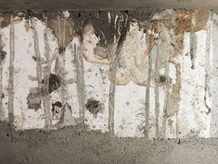 Wall texture with cement stains. Dirty and messy wall backgroundの写真素材