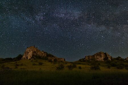 Clear spangled sky above cliffsの写真素材