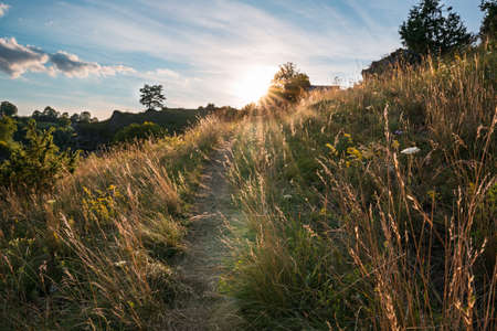 Rock hillside of Franconian Switzerland, sunset on summer evening