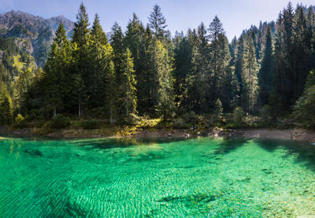 Turquoise mountain lake in Tannheimer Tal, sunny summer dayの写真素材