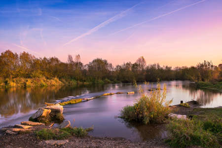 Sunset sky over Main river in autumn, long exposureの写真素材
