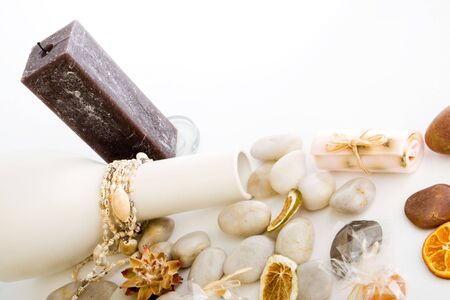 A collection of stones with a candle and soapの写真素材