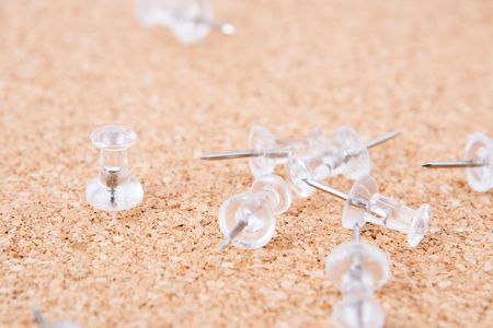 White push pins on a cork boardの写真素材