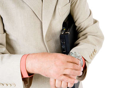 A business man looking at his watchの写真素材