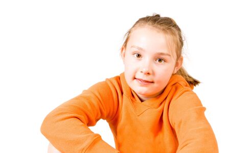A smiling girl in an orange jumper (2)の写真素材
