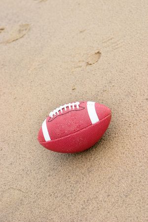 A American football on the beach in the rainの写真素材