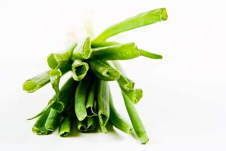 A bunch of spring onions on a white backgroundの写真素材