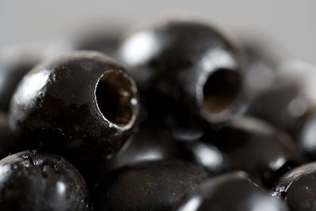 Close up of freshly stoned black olivesの写真素材
