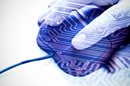 Computer mouse and hand with circuit board overlayの写真素材