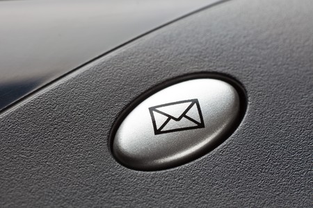 Envelope button on a black keyboardの写真素材