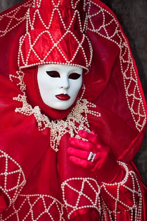 Red costume with white pearls at the Venice Carnivalの写真素材
