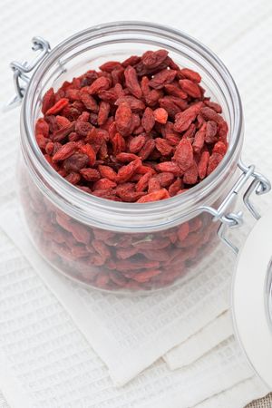 Goji berries in an open jarの写真素材