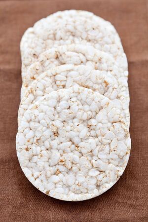 Pile of rice cakes on a brown clothの写真素材