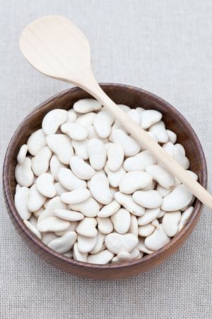 White butter beans in a wooden dish