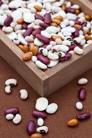 Mixed dried beans in a wooden box
