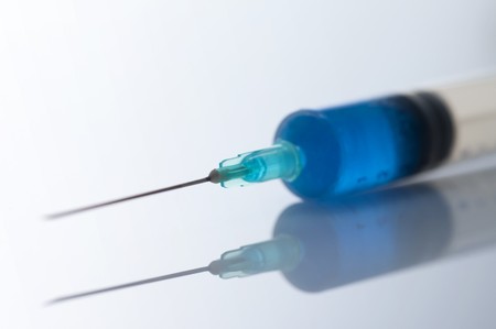 Medical syringe and needle with reflection image.の写真素材