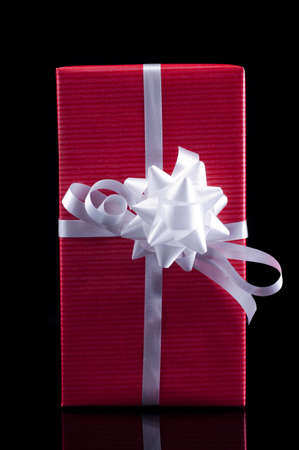 Red present isolated on black backgroundの写真素材