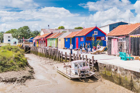 Colorful cabins on the harbor of ChÃ¢teau d'OlÃ©ron, on the island of OlÃ©ron in Franceのeditorial素材