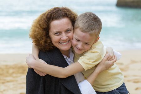 Mother her and her child huggingの写真素材