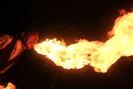 A photo of a fire breathing entertainerの写真素材