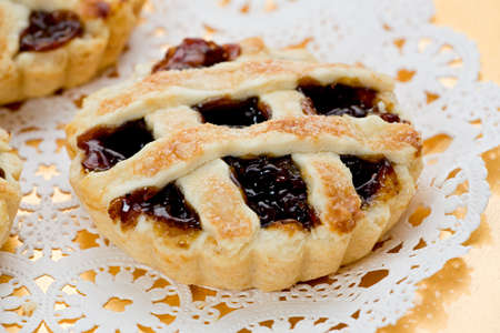 Mince tarts on gold plate.の写真素材