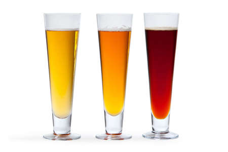 Three beers in glasses arranged from light to dark.