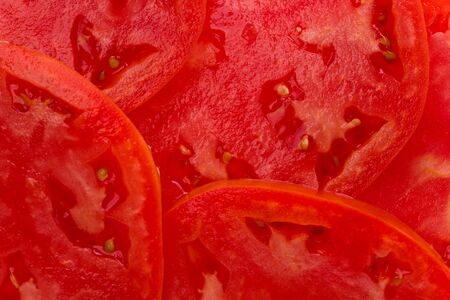 Background texture of freshly sliced tomatoes.の写真素材