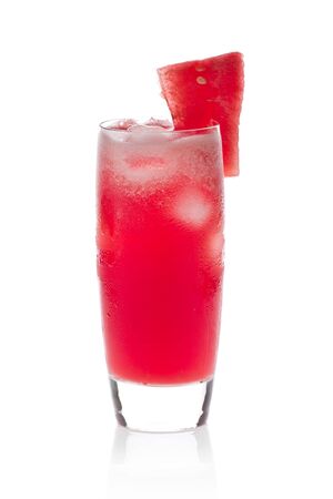 A glass of fresh, ice cold  watermelon juice against a white background.の写真素材