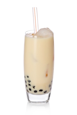 A glass of sweet banana milk tea with tapioca pearls, and straw on white background.の写真素材