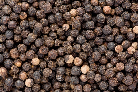 Background texture of whole, dried, black peppercorns.の写真素材