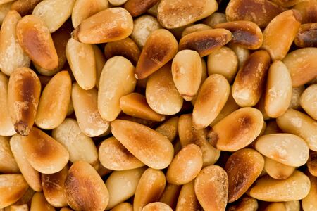 Background texture of roasted pine nuts.の写真素材