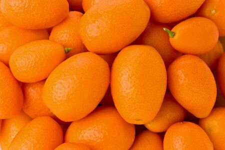 Background texture of several whole kumquats.の写真素材