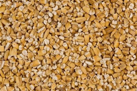 Background texture of steel-cut oats, or irish oats.の写真素材