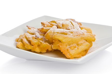 Homemade apple fritters on a white appetizer plate.の写真素材