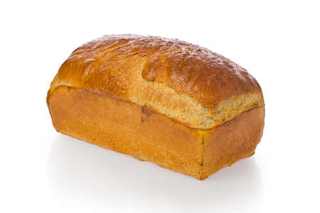 Fresh baked homemade bread loaf against a white background.の写真素材