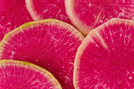 Background texture of several slices of watermelon radish, or roseheart radish.の写真素材