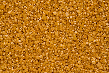 Background texture of gold sugar crystals.の写真素材