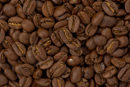 Background texture of whole medium roasted coffee beans.の写真素材