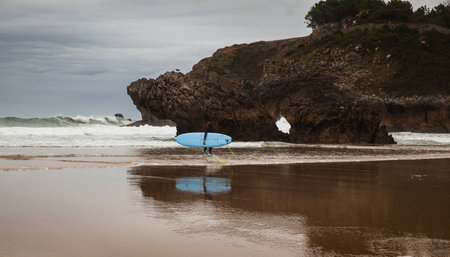 Cantabric beach at rising tide on a cloudy summer day