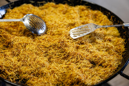 Close up of a fidegua with calamari in a big pot for a family meal.の写真素材