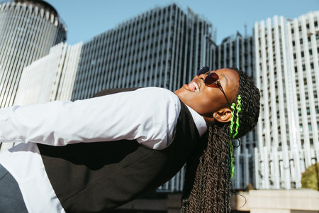 Teen girl dancing and leaning back with attitude in the cityの写真素材