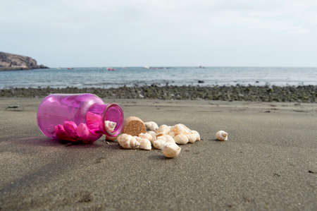 Bottle on sand