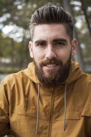 Portrait of a man in a fall landscape.