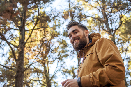 Portrait of a smiling man with autumnal background.の写真素材